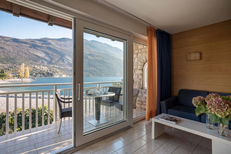 Delightful two-room holiday apartments with direct access to the beach in Torbole sul Garda